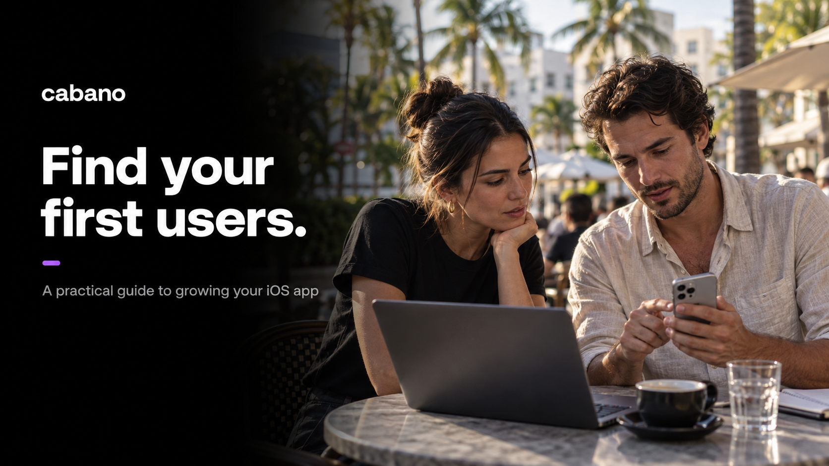 Find your first users. Two people review an iPhone app beside a laptop at a Miami cafe.